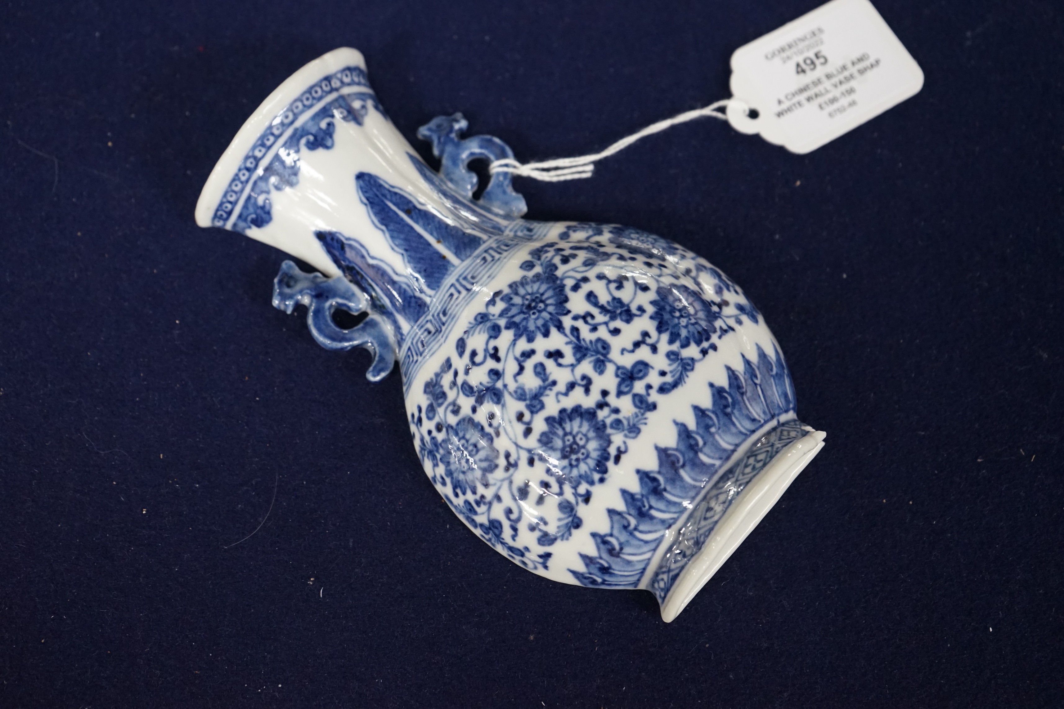A Chinese blue and white wall vase shaped pocket, 19th century, 16.5cm tall